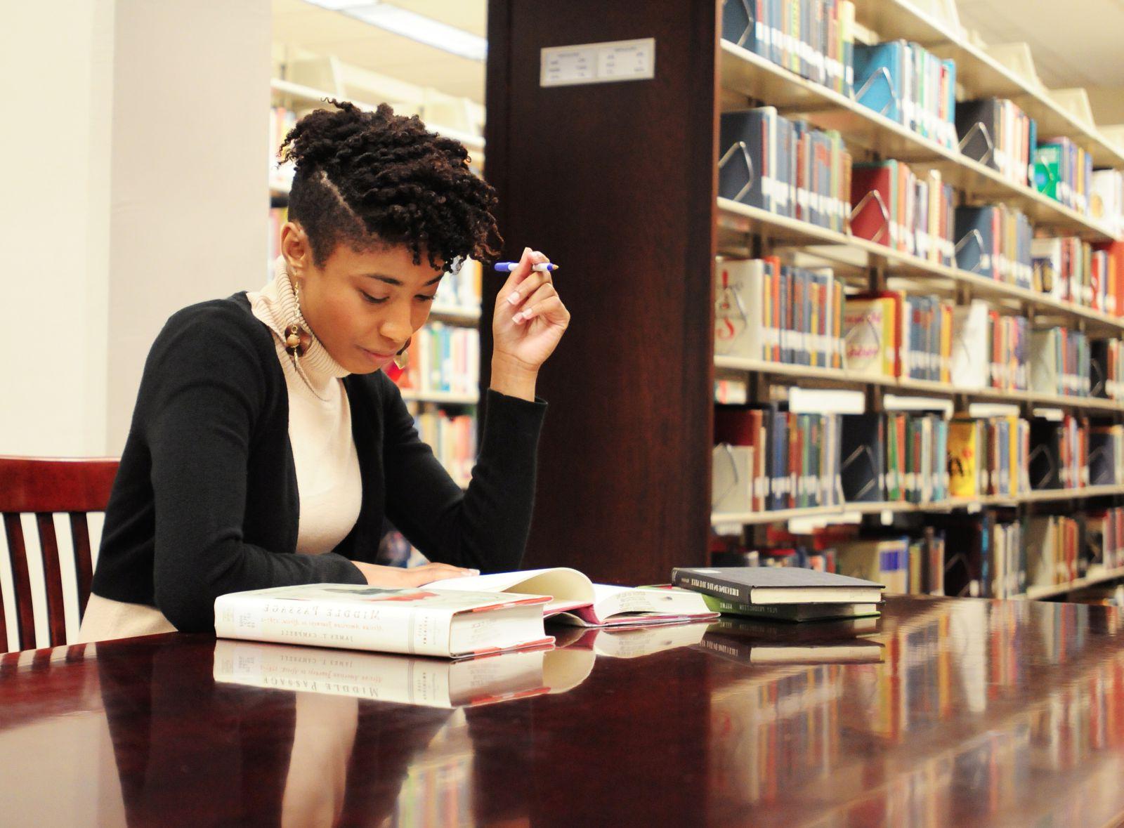 Photo of female student studying in Roberts Library